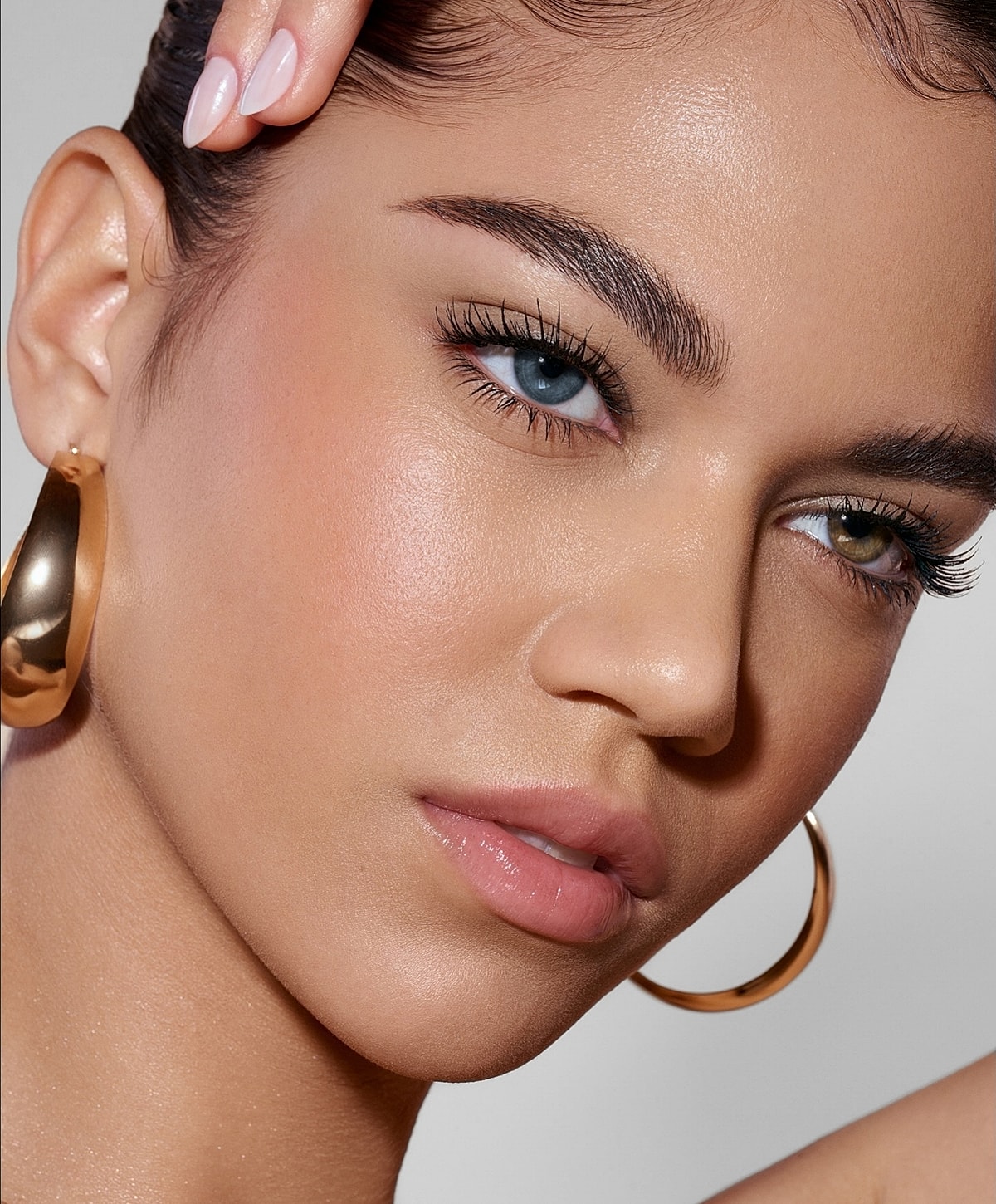 Close-up portrait of a woman with striking features.